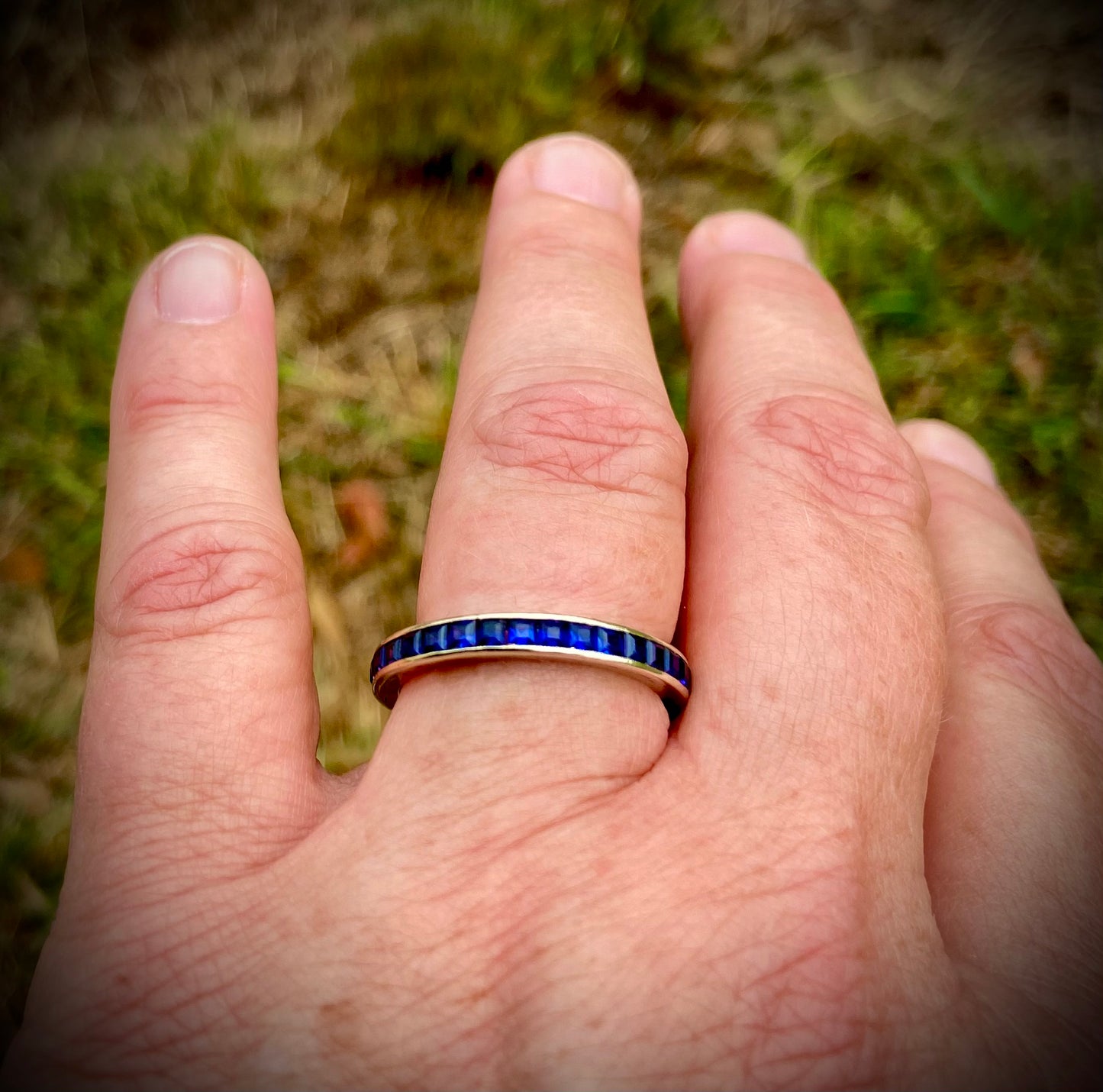 Stunning antique sapphire eternity ring, set in white gold.
