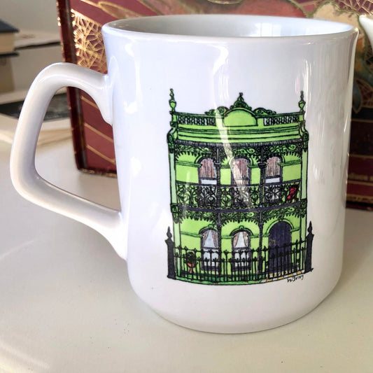 White coffee mug featuring  a watercoloured, green, Australian, Victorian era terrace house.  From original artwork.